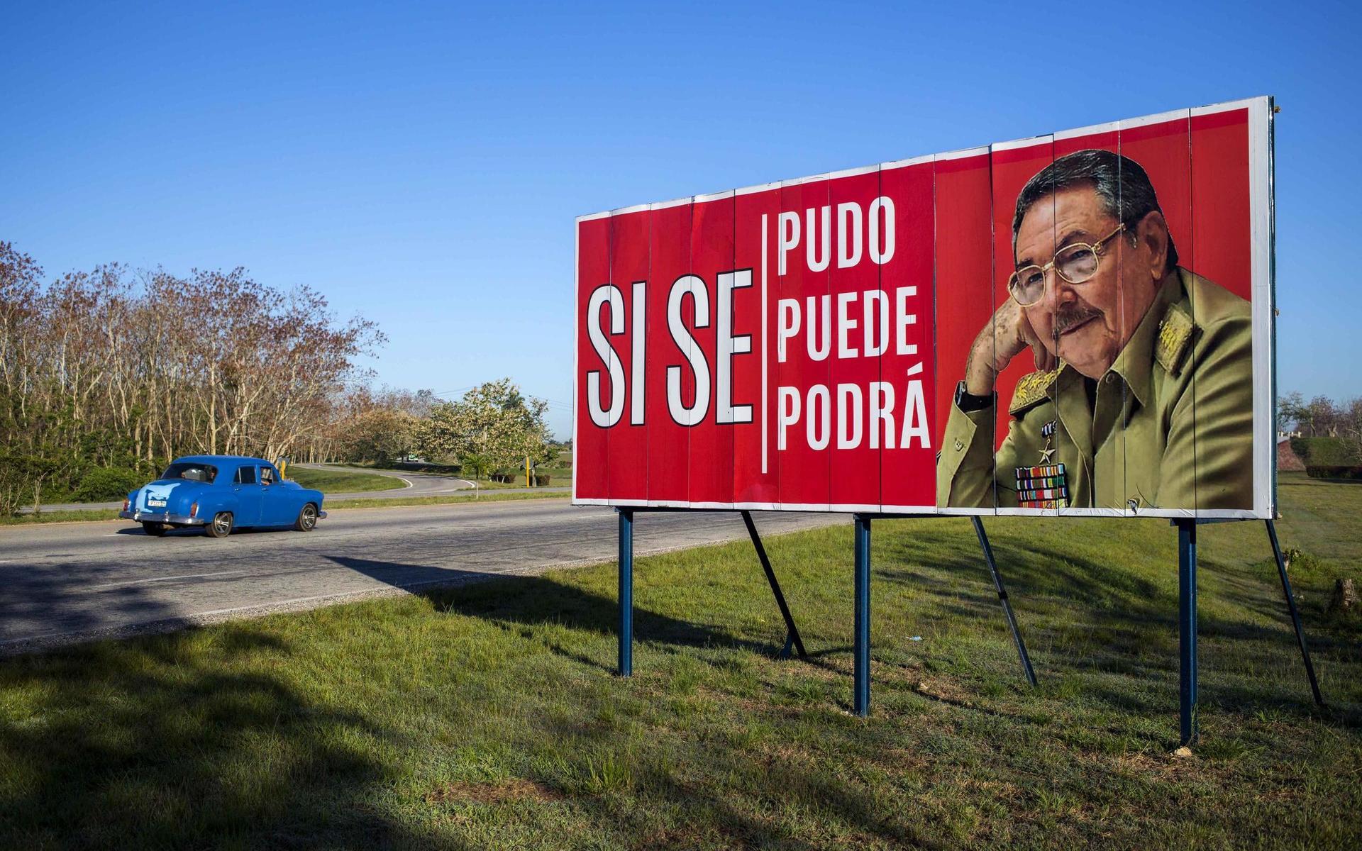 A car drives by a billboard that reads in Spanish &apos;¨Ít was, is and will be done,¨ with a picture of Cuba&apos;s President Raul Castro on the outskirts of Havana, Cuba, Wednesday, April 18, 2018. Cuba&apos;s legislature opened the two-day session that is to elect a successor to President Castro. (AP Photo/Desmond Boylan)